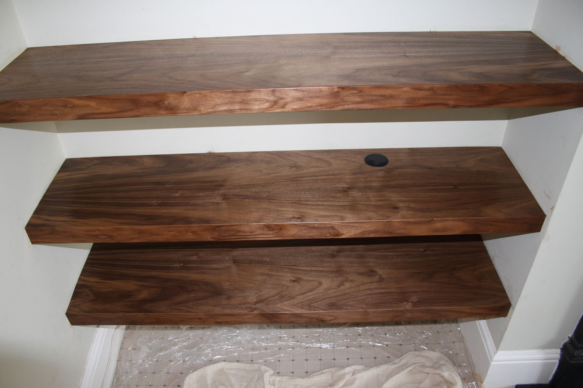 Bespoke built-in oak bookcase handmade in our workshop and fitted at a home in Hampshire